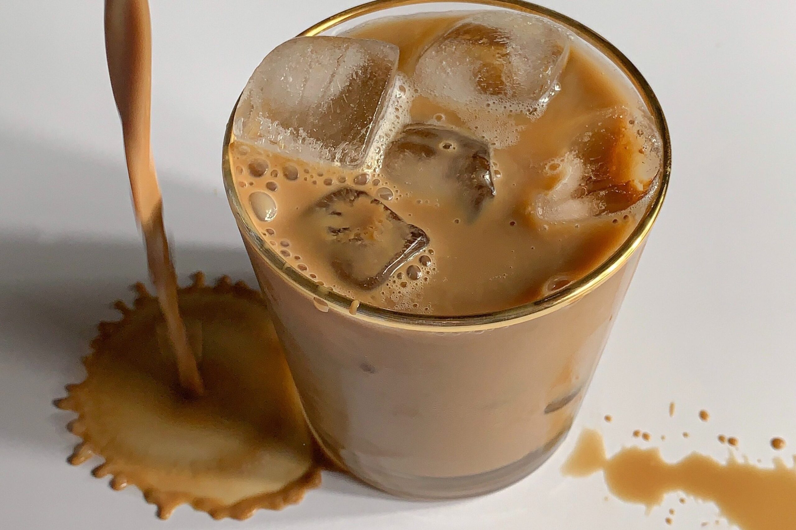 Iced coffee over-pour.