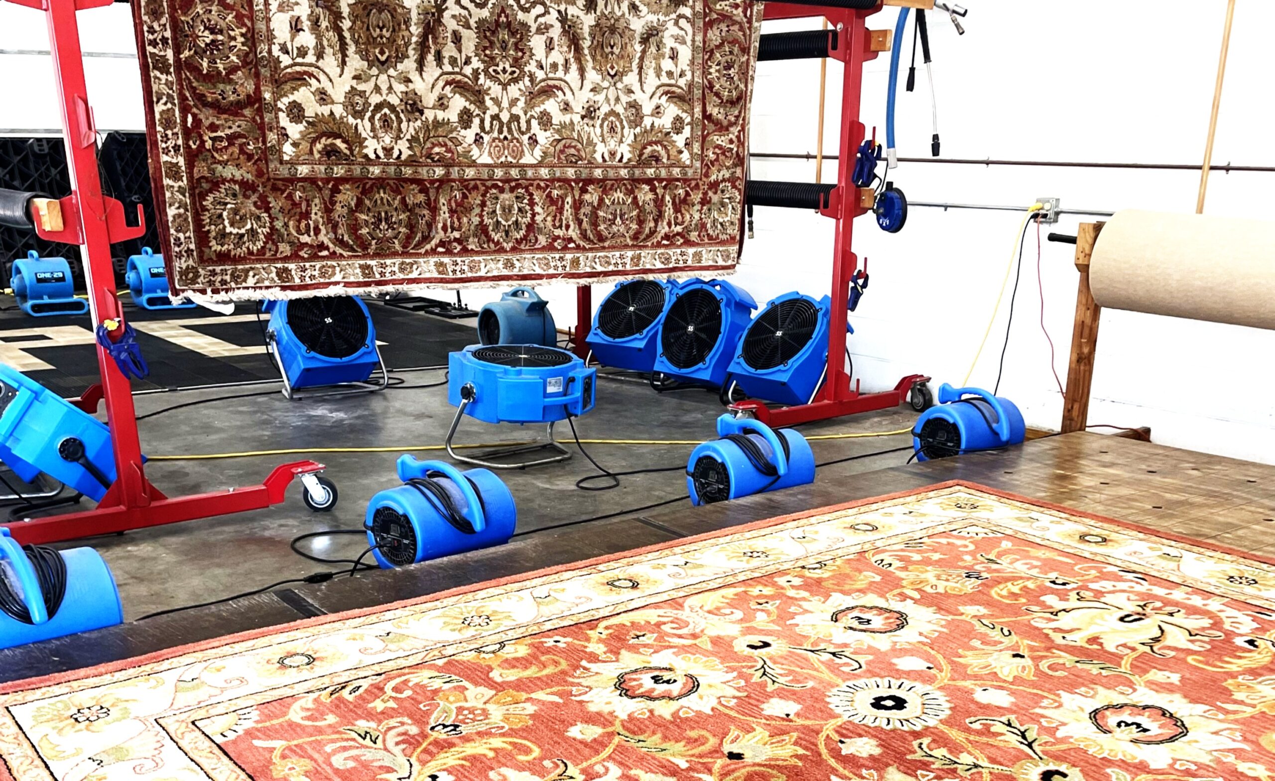A rug plant utilizes several drying methods aided by commercial fans for air circulation.